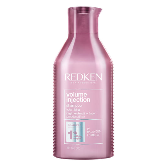 A bottle of Redken Volume Injection Shampoo, which is pink in color and has the brand and product name displayed on the label.